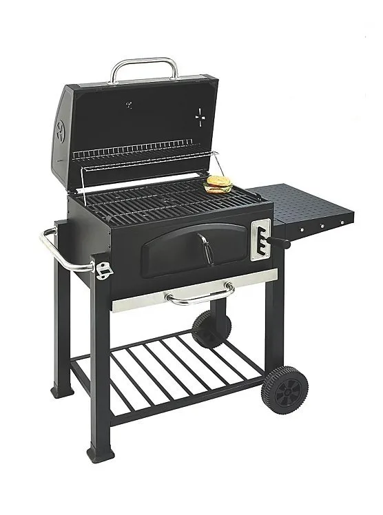 A black charcoal grill with a lid open, showing grill grates and a small food item, possibly a burger or sandwich, on the top warming rack. The grill features side shelves, front and bottom storage racks, a front access door for charcoal, and two wheels for mobility
